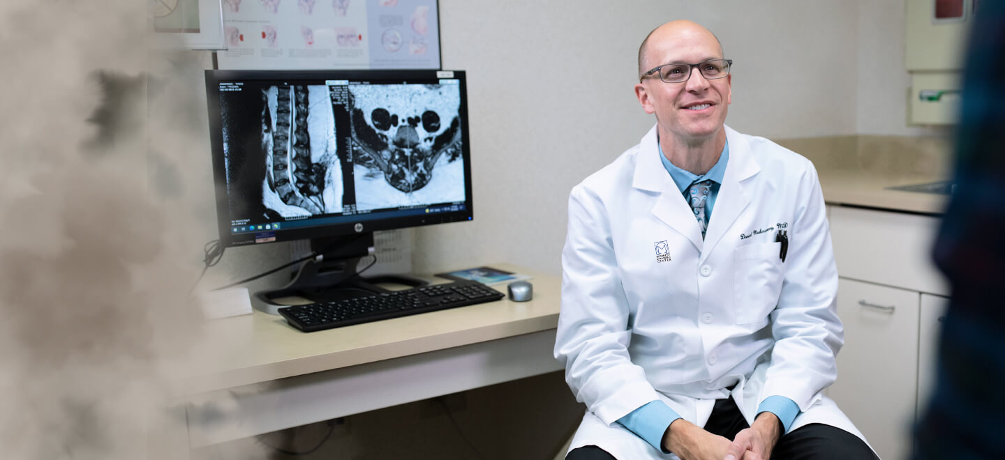 Dr. Mulconrey consulting with patient